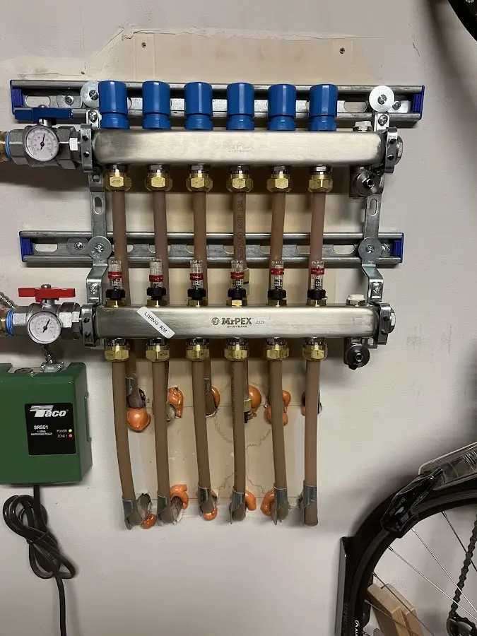 Plumber performing Gas Line Installation at a residential property in Maize